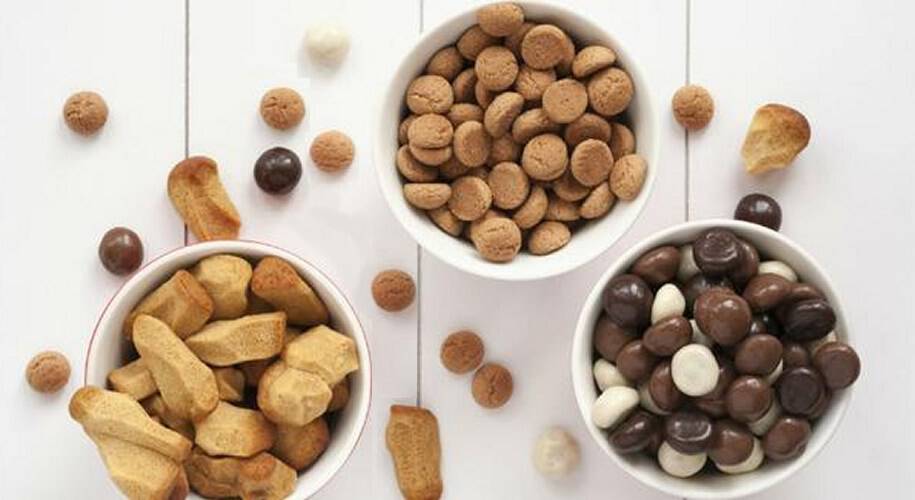 Clevere Konstruktion von Big-Bag-Abfüllanlagen für Van Delft Biscuits Die TBMA-Big-Bag-Abfüllanlagen spielen eine Schlüsselrolle beim internen Handling während der Pfeffernussproduktion und beim Überziehen dieser traditionellen Köstlichkeiten mit Schokolade.